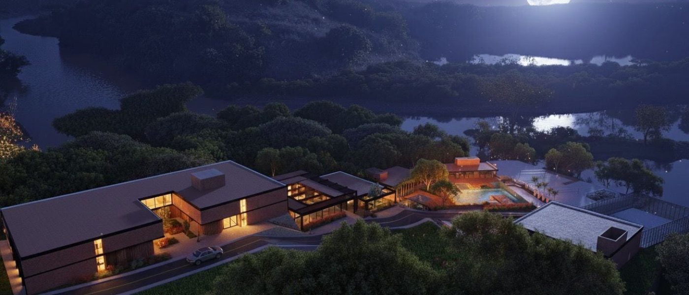 Vista noturna do Riviera Beach Club com iluminação e natureza ao redor.